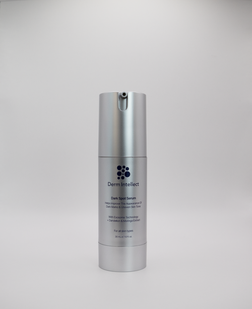 Derm intellect Dark Spot Serum in a sleek silver cylindrical pump bottle, centered against a neutral light gray background.